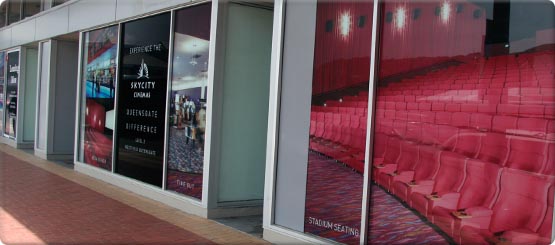 High impact signage applied to glass windows